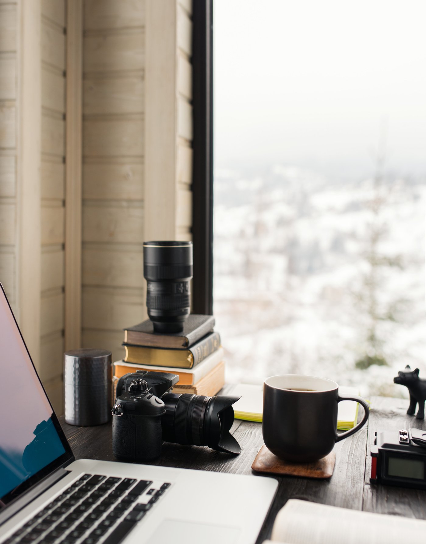 Audio / Video editing workspace office with mountain view. Photography and videography equipment.